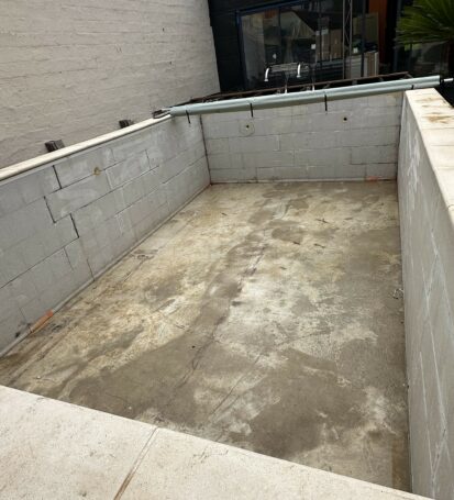 a concrete foundation with a pipe