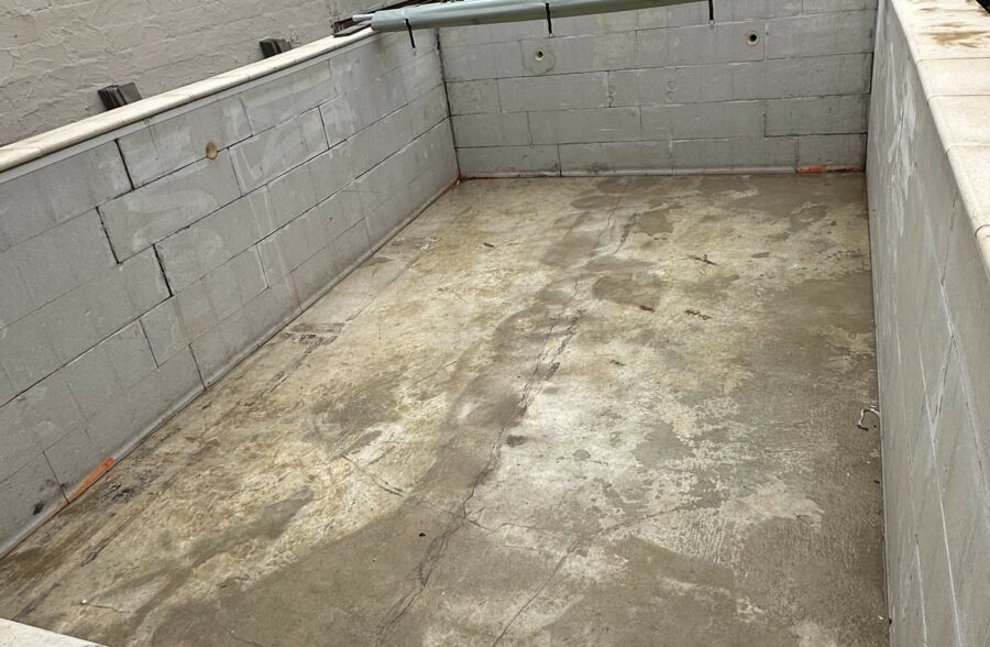 a concrete foundation with a pipe