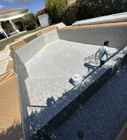 a man standing in a pool